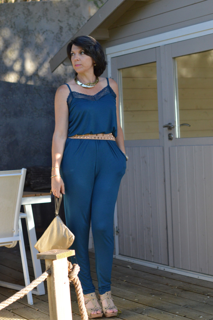 Jazzing up a simple blue jumpsuit with gold accessories